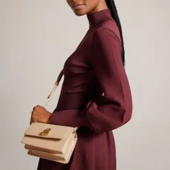Ted Baker SSLOANE Taupe Leather Padlock Mini Shoulder Bag 13 Ted Baker SSLOANE Taupe Leather Padlock Mini Shoulder Bag -Ted Baker Shop ted baker 270471 taupe ssloane taupe leather padlock mini shoulder bag lifestyle