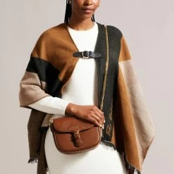 Ted Baker ESIA Brown Webbing Crossbody Saddle Bag 14 Ted Baker ESIA Brown Webbing Crossbody Saddle Bag -Ted Baker Shop ted baker 270675 brown esia brown webbing saddle crossbody bag lifestyle 1